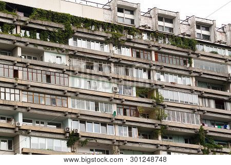 Facade Of Apartment Block With Many Windows