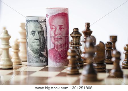Us Dollar And Yuan Banknote With Chess For Tariff Trade War Between United States And China Which Bo