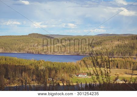 Beautiful Views Of The Mountains To The Lakes, Houses, Birches And Forest. Finnish Landscape. Lakes 