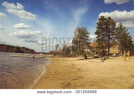 Beautiful Views Of The Lake, The Houses, Birch And Forest. Finnish Landscape. Lakes And Valleys. Sum