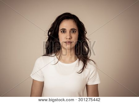Portrait Of Young Latin Woman Feeling Scared And Shocked Making Fear, Anxiety Gestures. Looking Terr