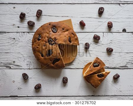 Honey And Date Cake On A White Wooden Background