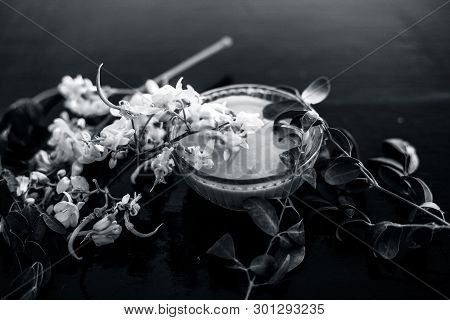 Ayurvedic Herb Drumstick Flowers Along With Some Leaves On Wooden Surface Along With Its Paste In A 
