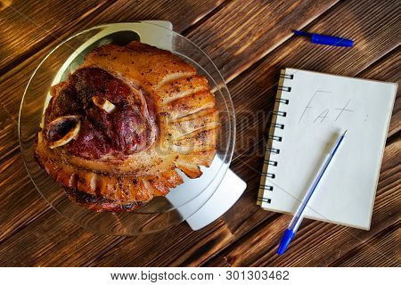 Fried Pork Leg In A Transparent Plate On The Kitchen Scale. Counting Calories, Proteins, Fats And Ca