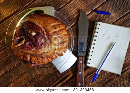 Fried Pork Knuckle In A Transparent Plate On The Kitchen Scale. Counting Calories, Proteins, Fats An