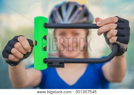 Girl With Bicycle  Lock. Bicycle U- Lock. Bike Protection