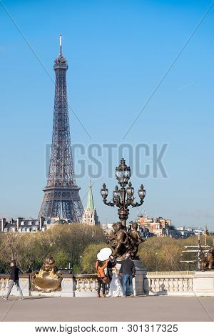 Paris, France - April 19 2016: A Wedding Photo-shoot On Alexander Bridge In Paris, With The Eiffel T