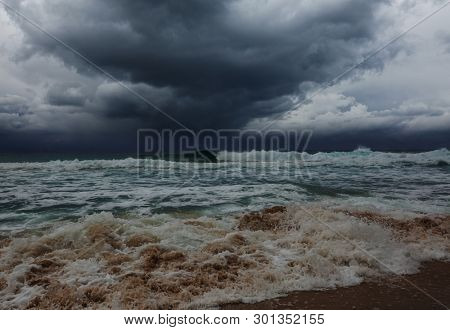storm clouds and dramatic waves in ocean