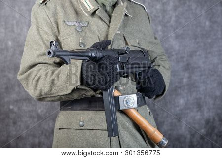A Ww Ii German Soldier With Machine Gun And Grenade