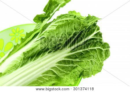 Chinese Cabbage Salad In A Plate On A Light Background. Leaves Green Fresh