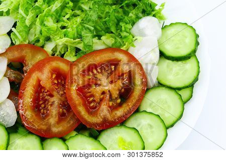 Sliced Vegetables Close-up: Tomatoes, Cucumbers, Peking Cabbage, Radishes. Light Background