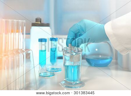 Scientific Background With Microscope Room And Microscopic Slide In Gloved Hand. Shallow Dof,toned I