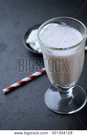 Glass Of Protein Shake And Glutamine. Nutrition For Bodybuilding. Black Stone Background. Copy Space
