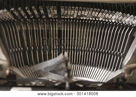 Close Up Of Typebars On An Old Typewriter
