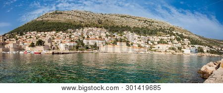 Mediterranean Panorama Of The Beautiful Dubrovnik Old City Including Mount Srd, The Old Port, City W