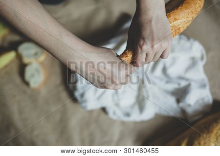 Food Concept. Hand Clicing A Bread. Cutting Bread. Top View. Free Space For Text. Copy Space