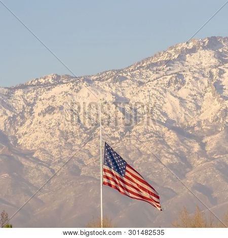 Square American Flag And Building With Mount Timpanogos And Sky In The Background