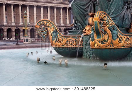 Fountain In The Place De La Concorde In Paris On A Gloomy Overcast Evening