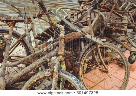 Porvoo, Finland - May 2019: Old Rusty Bicycles Abandoned On The River Bank In The Finnish City Of Po
