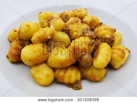 Close-up Of Potato Gnocchi With Bolognese Sauce (ragu) On A White Plate