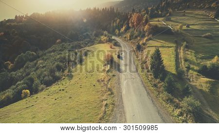 Mountain Hill Country Road Car Drive Aerial View. Roadside Automobile Highland Scenery Landscape Overview. Dense Green Forest Unpolluted Natural Environment Concept. Drone Flight