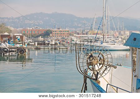 Iew Of The City Of La Spezia In Italy From The Sea And The Harbor With White Yachts On A Sunny Day