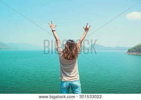 Funny Woman Standing And Hand Symbol, Love The Sky, River And The Mountains And Enjoy The Beautiful 