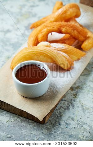 Churos Spanish Dessert. Gray Textured Background. Beautiful Serving Dishes. Dessert. Food Chain