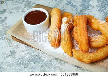Churos Spanish Dessert. Gray Textured Background. Beautiful Serving Dishes. Dessert. Food Chain