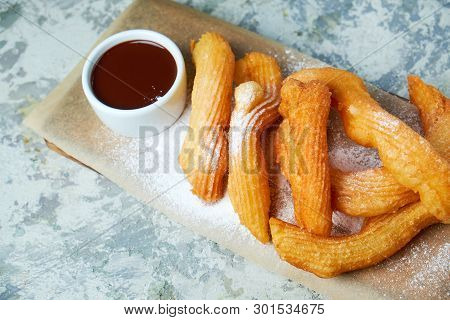 Churos Spanish Dessert. Gray Textured Background. Beautiful Serving Dishes. Dessert. Food Chain