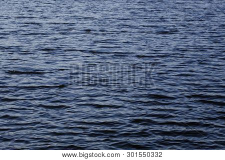Light Playing On The Sea Surface. Water Surface. Sea Surface. Water Background. Blue Water Surface.