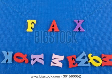 Fax Word On Blue Background Composed From Colorful Abc Alphabet Block Wooden Letters, Copy Space For