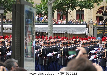France, Paris - July 14, 2014: Participants And Spectators At The Parade In Honor Of The Bastille Da