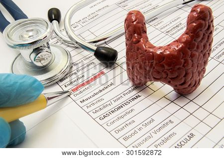 Thyroid Problems Concept Photo. Doctor Points In Diagnosis Process To Inscription Thyroid Problems O