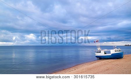 Fishing Boat On Baltic Sea Coast. Stormy Weather. Mechelinki, Poland, Pucka Bay.