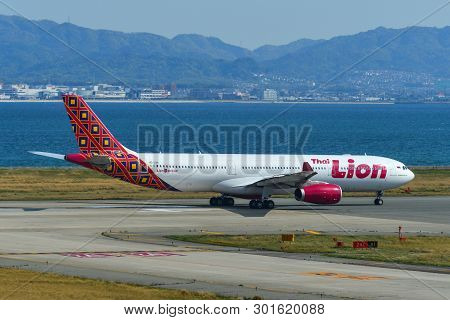 Passenger Airplane Taxiing On Runway