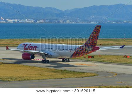 Passenger Airplane Taxiing On Runway