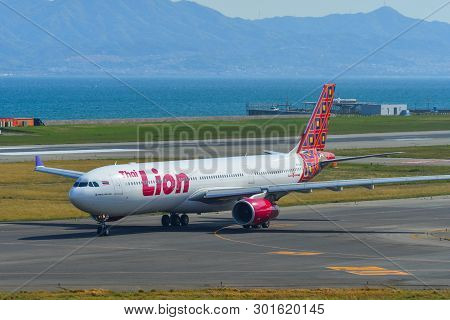 Passenger Airplane Taxiing On Runway