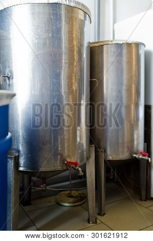 A Number Of Steel Tanks For Mixing Liquids. Stainless Steel, Food Industry.