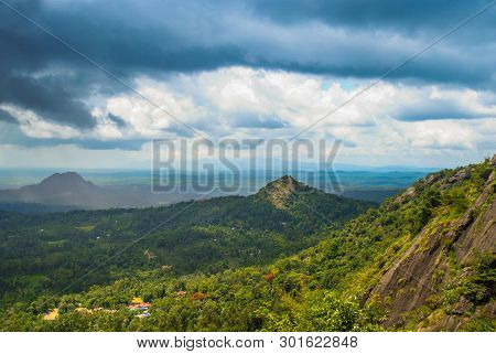 Beautiful Nature Scenery Of Wayanad Edakkal Cave, Blue Cloudy Sky With Green Mountains