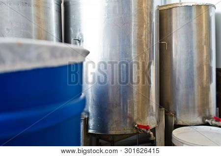 A Number Of Steel Tanks For Mixing Liquids. Stainless Steel, Food Industry.