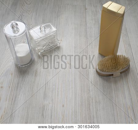 Cosmetic Flatlay On Grey Wooden Table. Beauty Set Of Plastic Containers With Q-tips And Disks. Space
