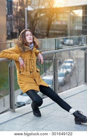 Fashion model posing outdoor. Young blond caucasian woman posing winter outdoo. Beautiful girl, urban portrait.