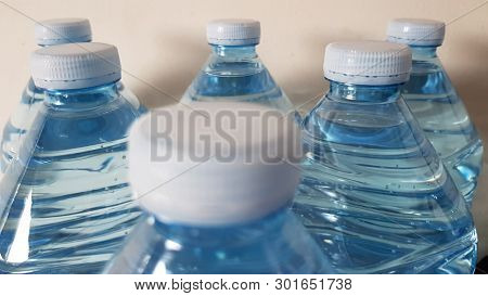 Plastic Bottles Focus On The Far Row Of Caps