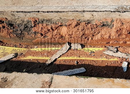 A Trench Showing A Cross Section Of A Road.