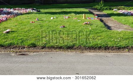 Rubbish Left Behind By A Group Of Youths In A City Centre Park.