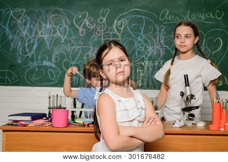 Smart Children Performing Chemistry Test. Small Pupil Learning Chemistry In School. Chemistry Labora
