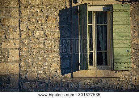 View On Window In Medieval House In Provence In Sun Lights During Sunrise, South Of France