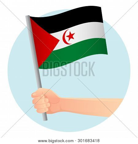 Sahrawi Arab Democratic Republic Flag In Hand. Patriotic Background. National Flag Of Sahrawi Arab D