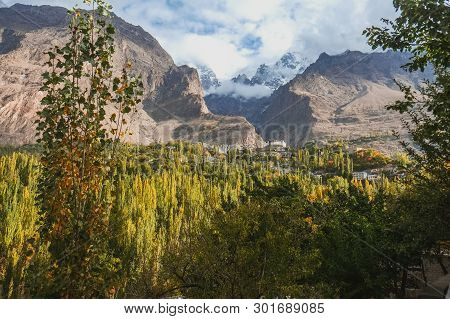Beautiful Scenery Panoramic View In Hunza Valley. Nature Landscape Of Lush Green Forest With Clouds 